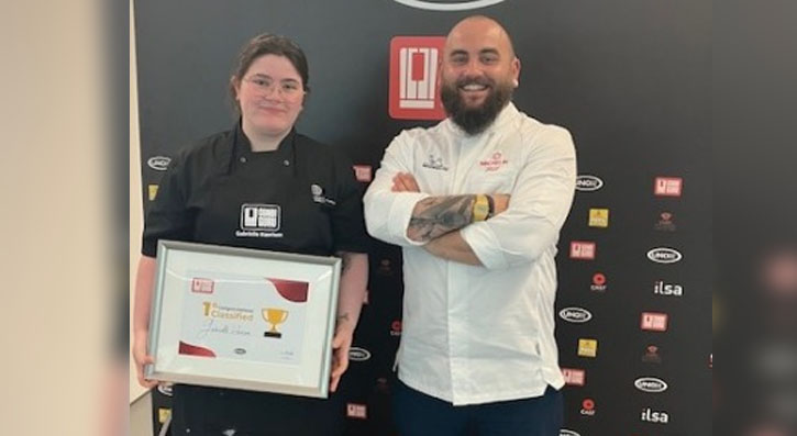 SERC Trainee Gabby Harrison (left), holding her winner's certificate, with chef Nathan Davies  